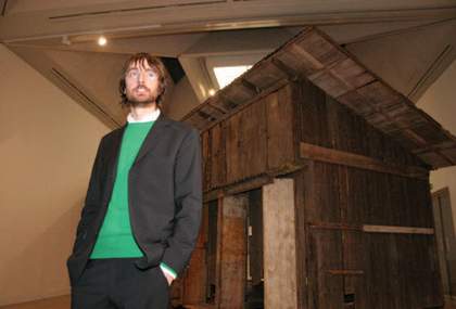 Simon Starling with Shedboatshed (Mobile Architecture No 2), after receiving the 2005 prize