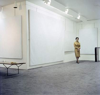 Yayoi Kusama with works from her Infinity Net series at the Stephen Radich Gallery, New York, 1961