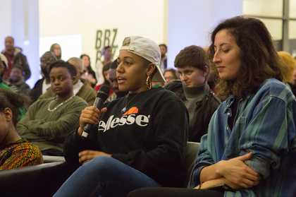 A person speaking in to a mic
