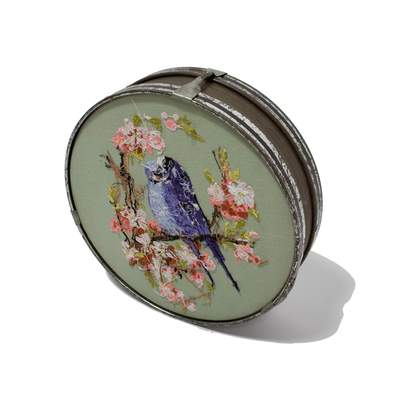 A drum with an Image of a bird