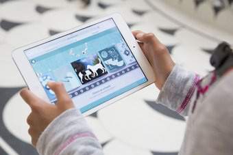 Photograph of a child playing on the Tate Kids website