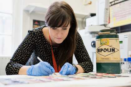 Someone on the Tate Science and Conservation team sampling paint 