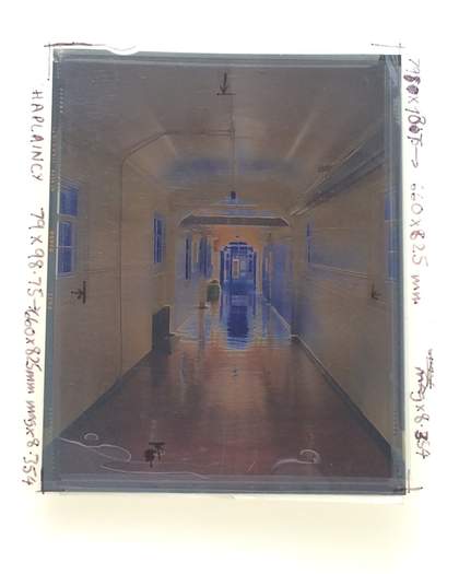 Close-up of a rectangular image against a lightbox - photographic transparency with notes written around the edges