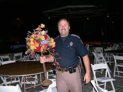 Jeremy Deller Cop with Flowers, San Antonio, Texas 2003