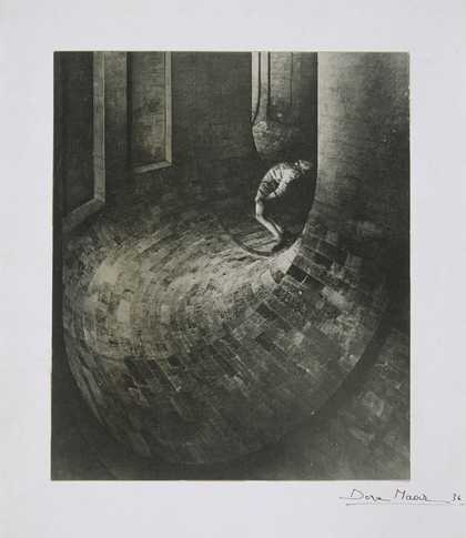 Black and white photograph of a figure leaning backwards while standing in a tunnel