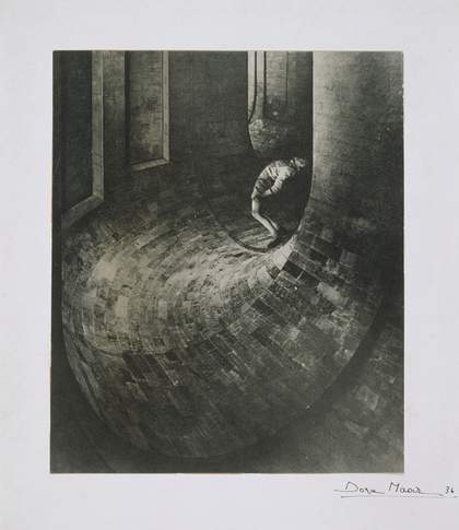 Black and white photograph of a figure leaning backwards while standing in a tunnel
