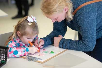 Mother and daughter drawing at a workshop