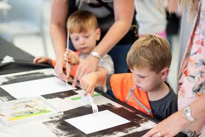 Children drawing at a Tate Liverpool workshop