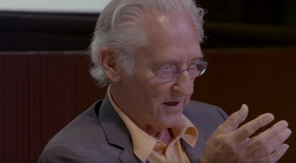 film still of ed ruscha sitting in a chair and speaking
