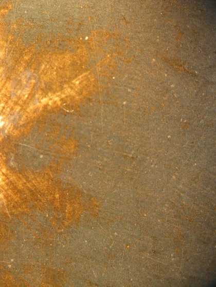 Fig.13 Detail of worn grey paint in the background, showing the yellowish-brown underpaint 