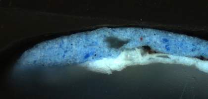 Cross-section of paint showing layer structure in visible light