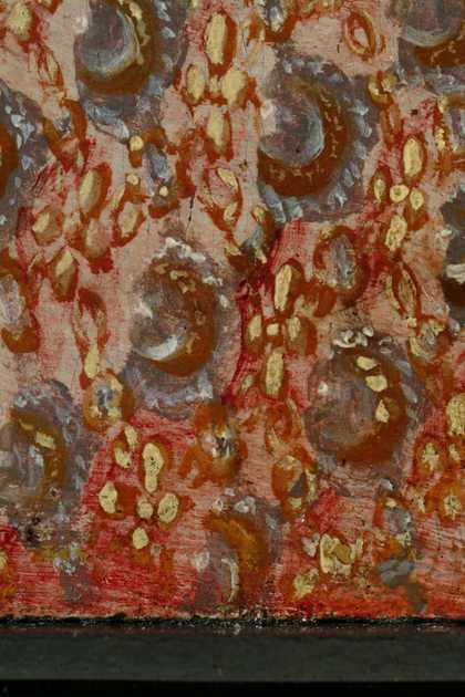 Detail of the dress at the lower edge where it has been protected from light by the frame. Unfaded red glaze and applied patterning on top of it 