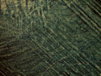 Detail of the blue background within the repainted area of the face