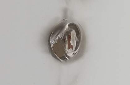 Fig.3 The central hole in Peeters’s Burn Hole photographed in raking light