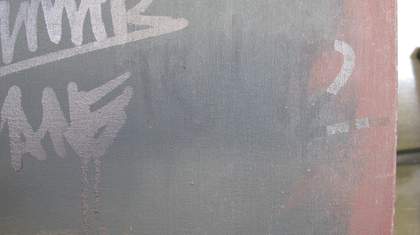 Detail of ink removal from the black paint area of Black on Maroon