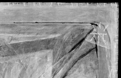 Detail of digital X-radiograph showing tear in the upper-right corner