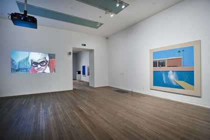 Fig 3 Installation view of David Hockney’s A Bigger Splash 1967 (right) with Jack Hazan’s film, A Bigger Splash 1973 (left) in the exhibition A Bigger Splash 2012