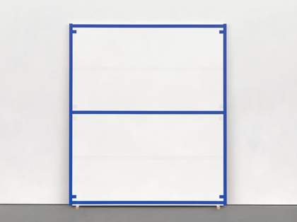A painting of blue lines and tabs enclosing white spaces, standing on wedges and leaning against a gallery wall.