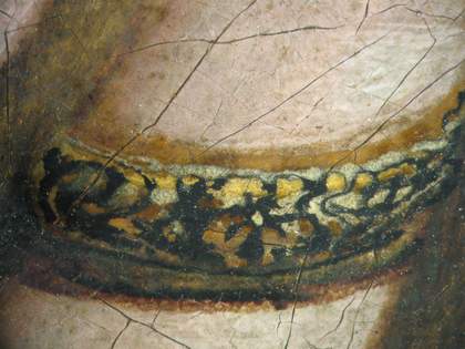 Fig.9 Detail of the ring at x8 magnification, showing the reserve left for it in the flesh paint