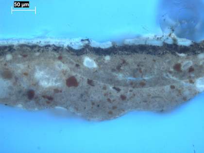 Fig.11 The same cross-section as fig.10, photographed in ultraviolet light, showing the microcissing in the black paint