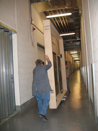 Art handlers carrying Lord Ligonier by Sir Joshua Reynolds