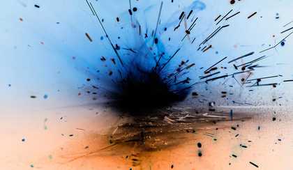 An abstract colourful image of an explosion in bright blue and peach