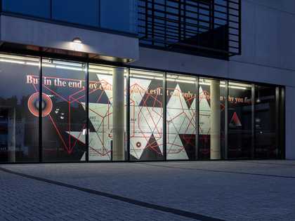Nighttime street view of Focal Point Gallery
