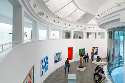 people looking at Modern art display