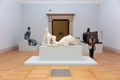 A visitor in the Henry Moore gallery at Tate Britain