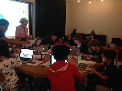 Kids working on their 3D designs at computers