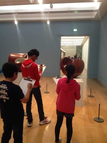 Young people drawing in the galleries at Tate Britain
