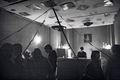 Inside Galerie Im Regierungsviertels Forgotten Bar Berlin photograph an interior filled with people and a bar with a bar tender 