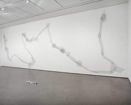 Installation view from the exhibition Art Now: David Musgrave, showing Giant torn tape figure (grey) 2003 and Paper golem 2003