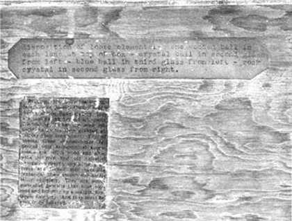 Joseph Cornell Close-up of label at top left giving detailed directions about the placement of the elements of Planet Set, typed presumably by Cornell. Underneath it is the press cutting cited at the 