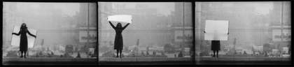 KwieKulik Open Form – Tribune of Honour, Poland 1971 showing three black and white film frames of a woman holding big white card
