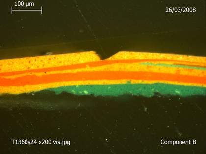 Magnified view of cross-section of paint layers taken from one of the columns, showing King's technique of painting the sculpture in layers.