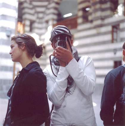 I see you you see me, Syrian series 2008 photograph from Nahnou Together exhibition at Tate Britain showing a young man looking through a camera at the photographer
