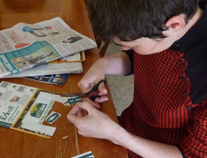Sarah cutting out letters