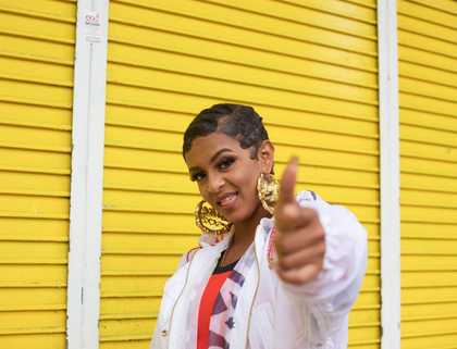 A woman pointing at the camera