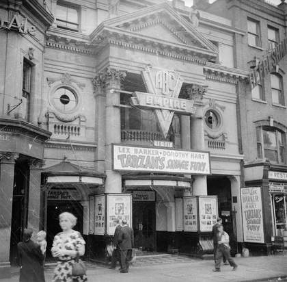 black and white photograph of a street scene of ABC empire theatre in the late 1940s early 50s 