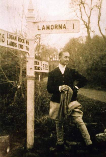 Digital image of a portrait of Marlow Moss standing by a direction post