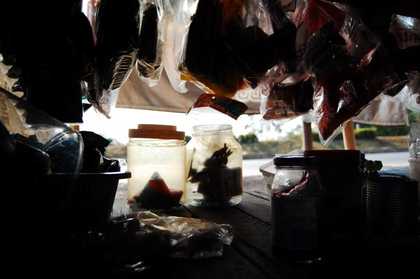 silhouette of bags and jars of spices in a shelf
