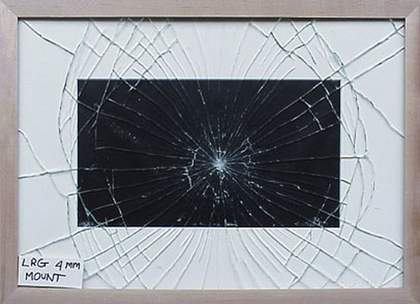 Regular cobweb breakage pattern of standard low reflective glass fitted in frame with window mount