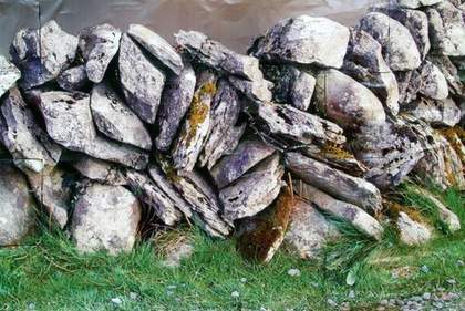 Rita McBride Rock Wall 2008 photograph of a dry stone wall and green grass