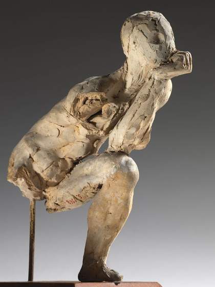 Auguste Rodin Study for The Thinker, a plaster sculpture of a man with his chin resting on his fist in a completive pose