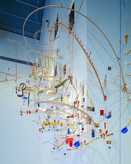 A hanging sculpture made of many different materials 