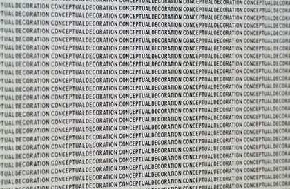 Stefan Bruggemann Conceptual Decoration Black on Silver 2009 silver wallpaper printed with the phrase Conceptual Decoration repeated in black arial font 