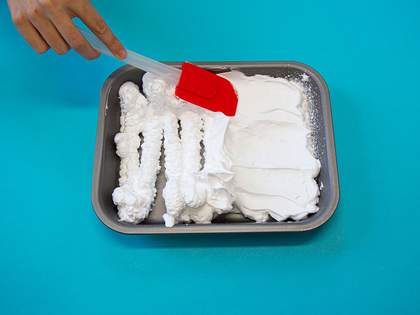 smoothing the foam down with a spatula 