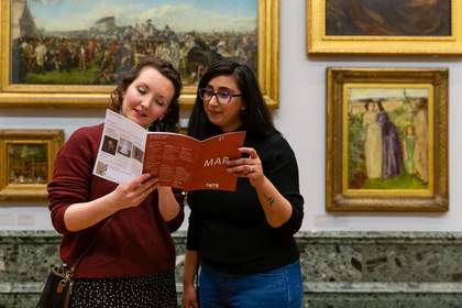 two people look at a map in Tate gallery