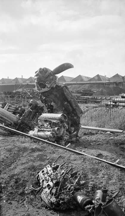 Black and white photograph of a damaged aeroplane